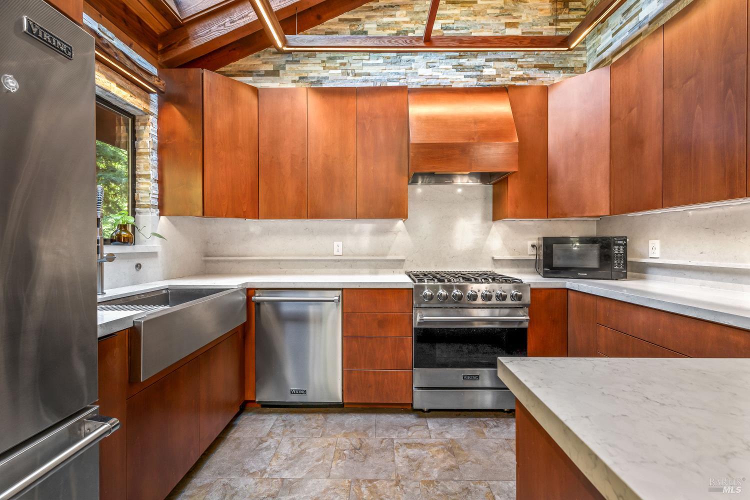 17451 Redwood Springs Drive Fort Bragg, CA 95437 - Photo 9 of 43 a kitchen with stainless steel appliances granite countertop a stove a sink and a microwave