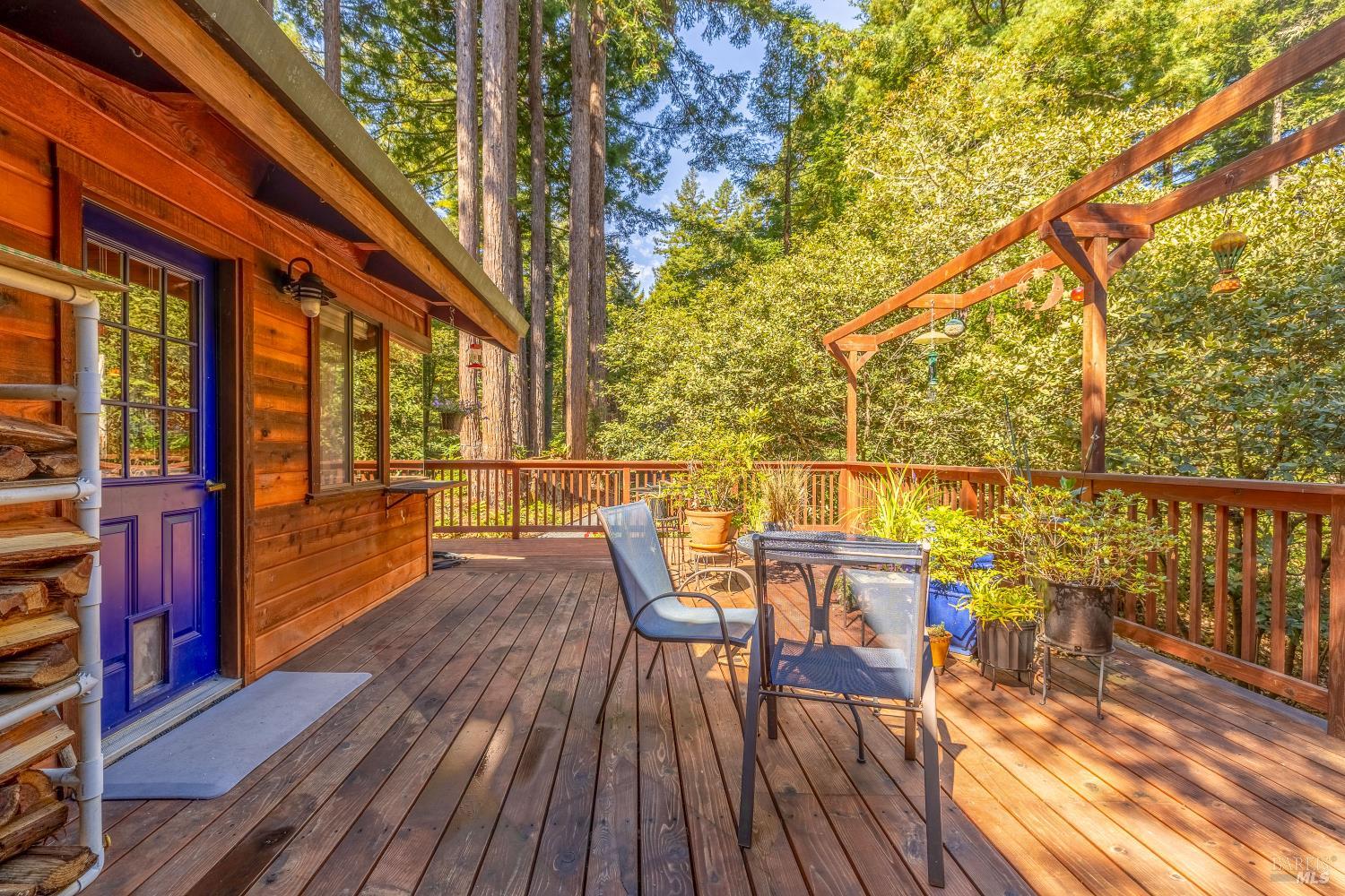 17451 Redwood Springs Drive Fort Bragg, CA 95437 - Photo 10 of 43 a view of a balcony with chairs and wooden floor