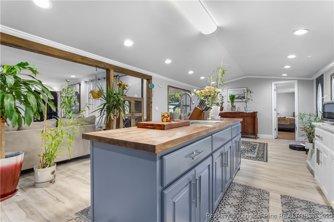 1855 Beaman Woods Road Clinton, NC 28328 - Photo 11 of 50 a kitchen with counter top space and living room