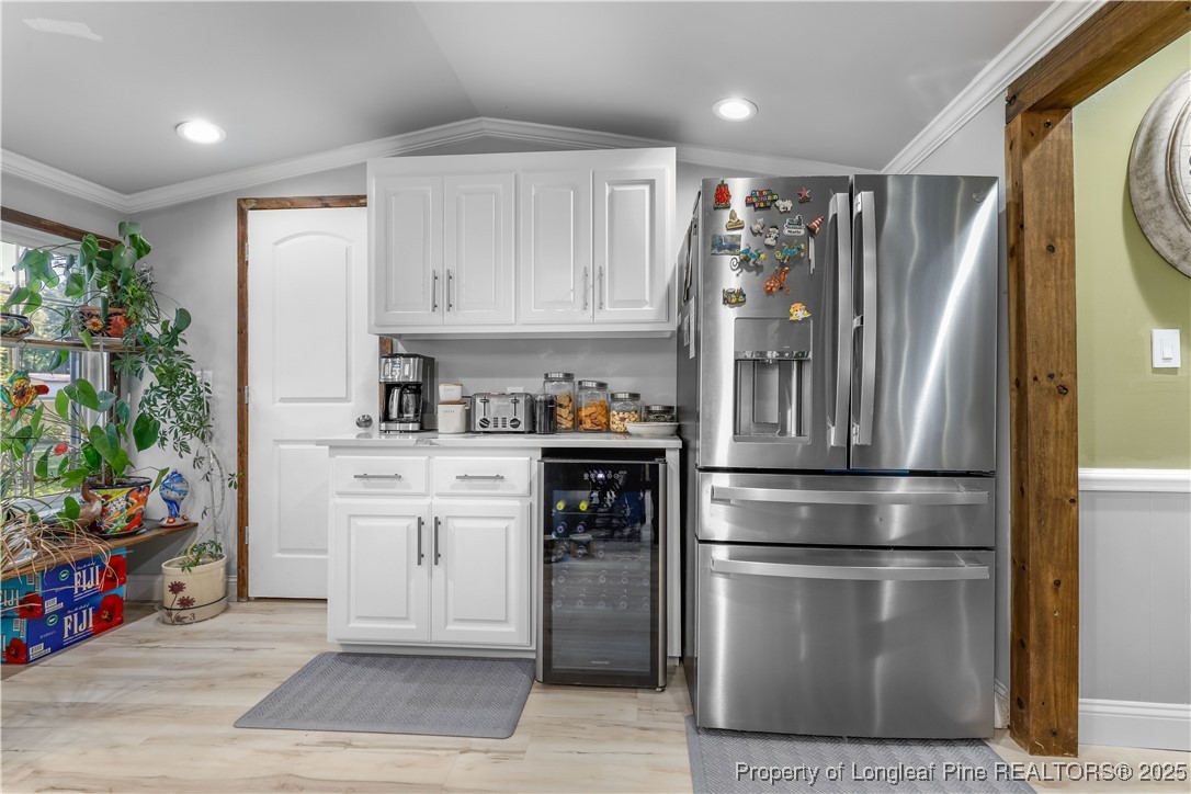 1855 Beaman Woods Road Clinton, NC 28328 - Photo 13 of 50 a kitchen with stainless steel appliances a refrigerator sink and cabinets