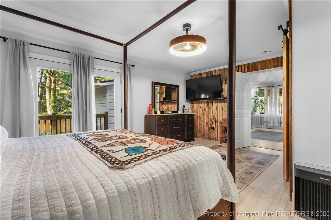 1855 Beaman Woods Road Clinton, NC 28328 - Photo 18 of 50 a bedroom with a bed and a large window