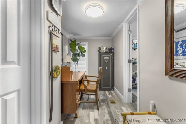 a view of a hallway with dining area and glass door