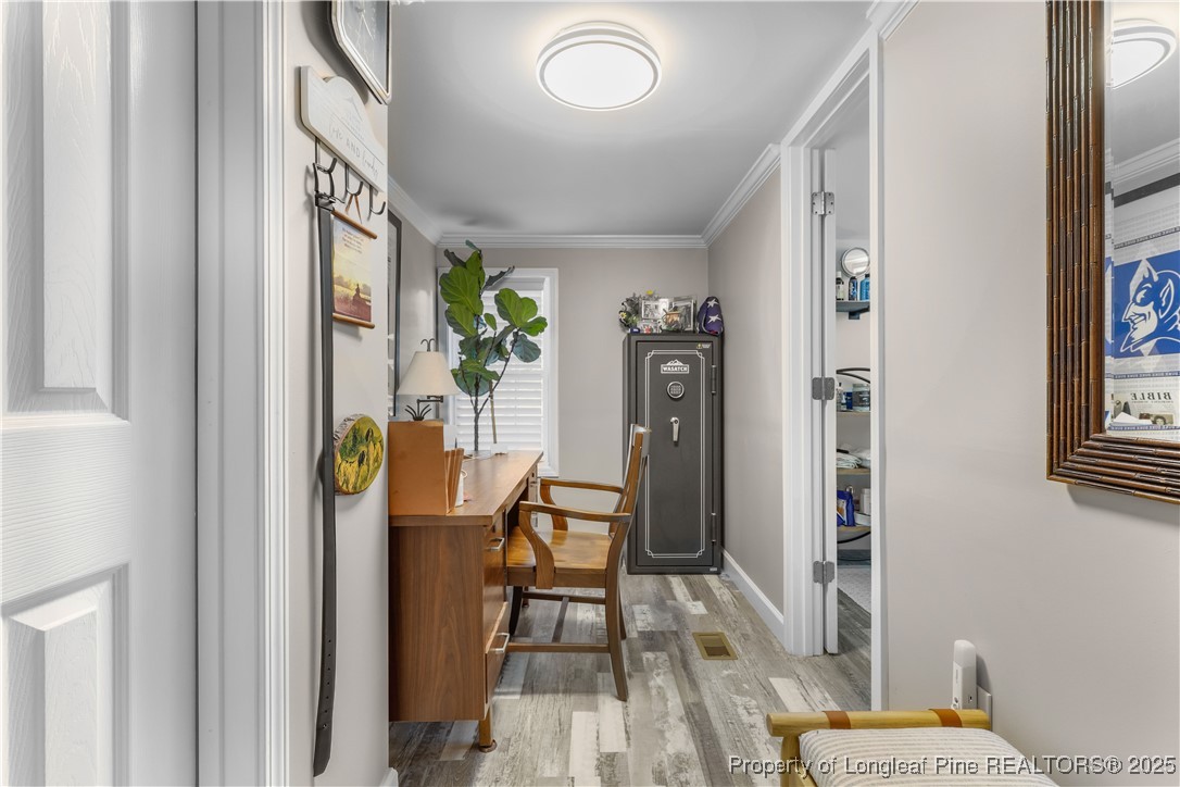 1855 Beaman Woods Road Clinton, NC 28328 - Photo 19 of 50 a view of a hallway with dining area and glass door