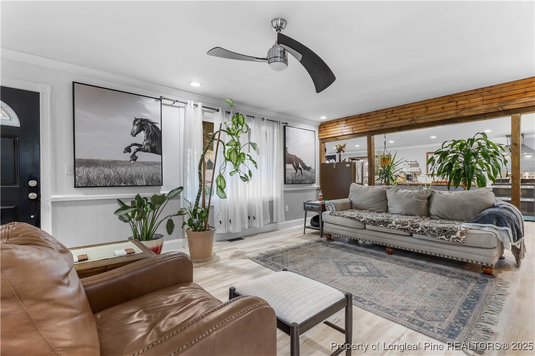1855 Beaman Woods Road Clinton, NC 28328 - Photo 2 of 50 a living room with furniture and a large window