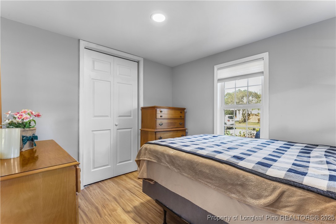 1855 Beaman Woods Road Clinton, NC 28328 - Photo 25 of 50 a bedroom with a bed and a window