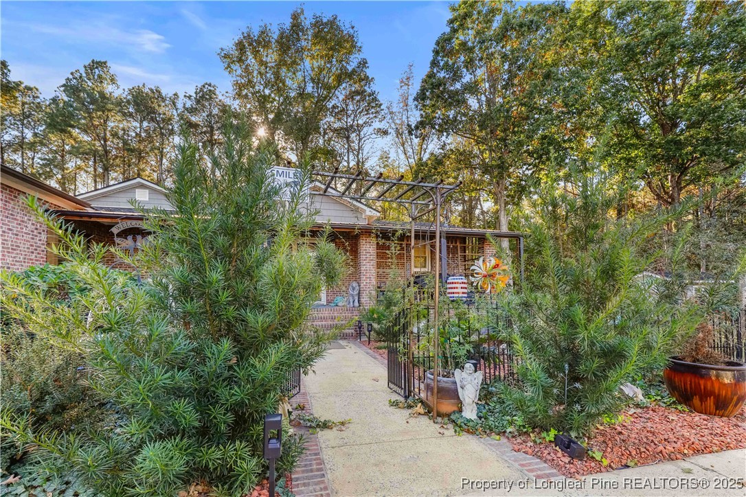 1855 Beaman Woods Road Clinton, NC 28328 - Photo 32 of 50 a front view of a house with lots of green space