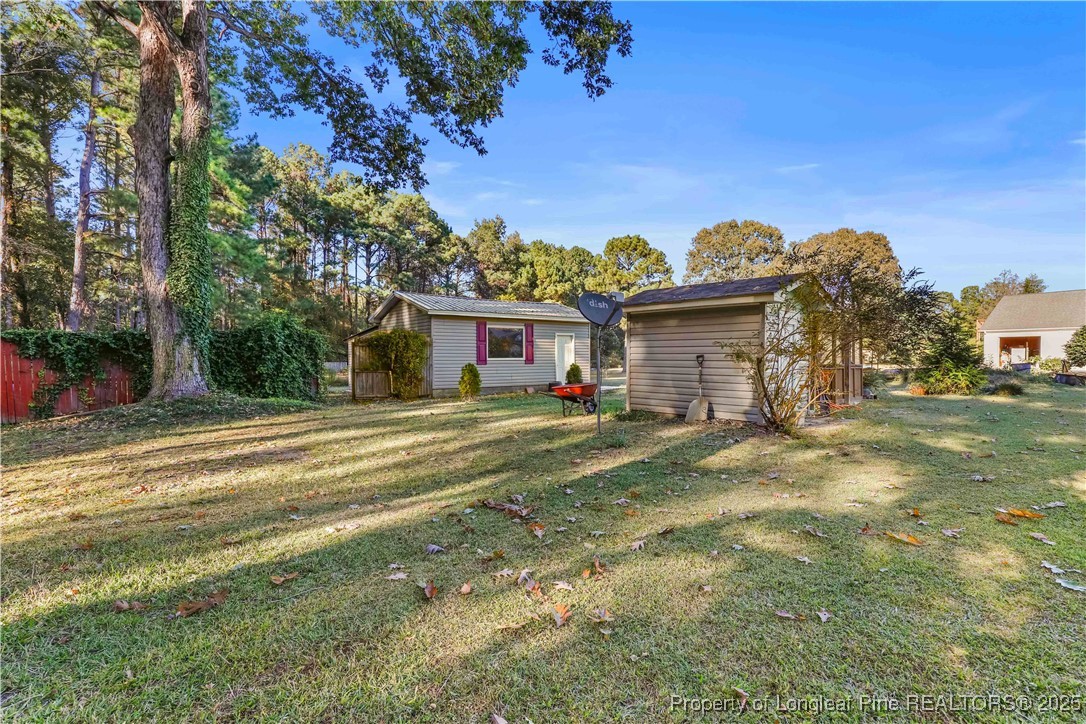 1855 Beaman Woods Road Clinton, NC 28328 - Photo 37 of 50 a view of a house with a yard