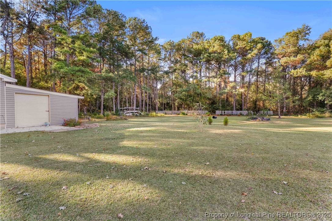 1855 Beaman Woods Road Clinton, NC 28328 - Photo 38 of 50 a ground with lots of trees