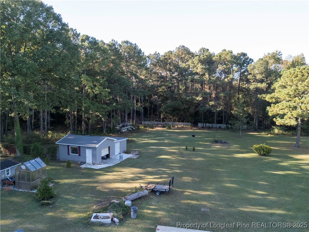 1855 Beaman Woods Road Clinton, NC 28328 - Photo 41 of 50 a view of a house with a yard