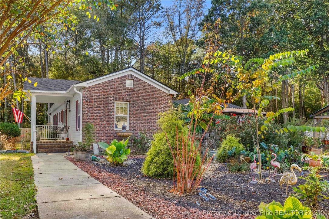 1855 Beaman Woods Road Clinton, NC 28328 - Photo 42 of 50 a front view of a house with a yard