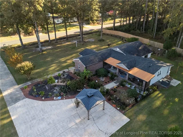 an aerial view of residential house with outdoor space