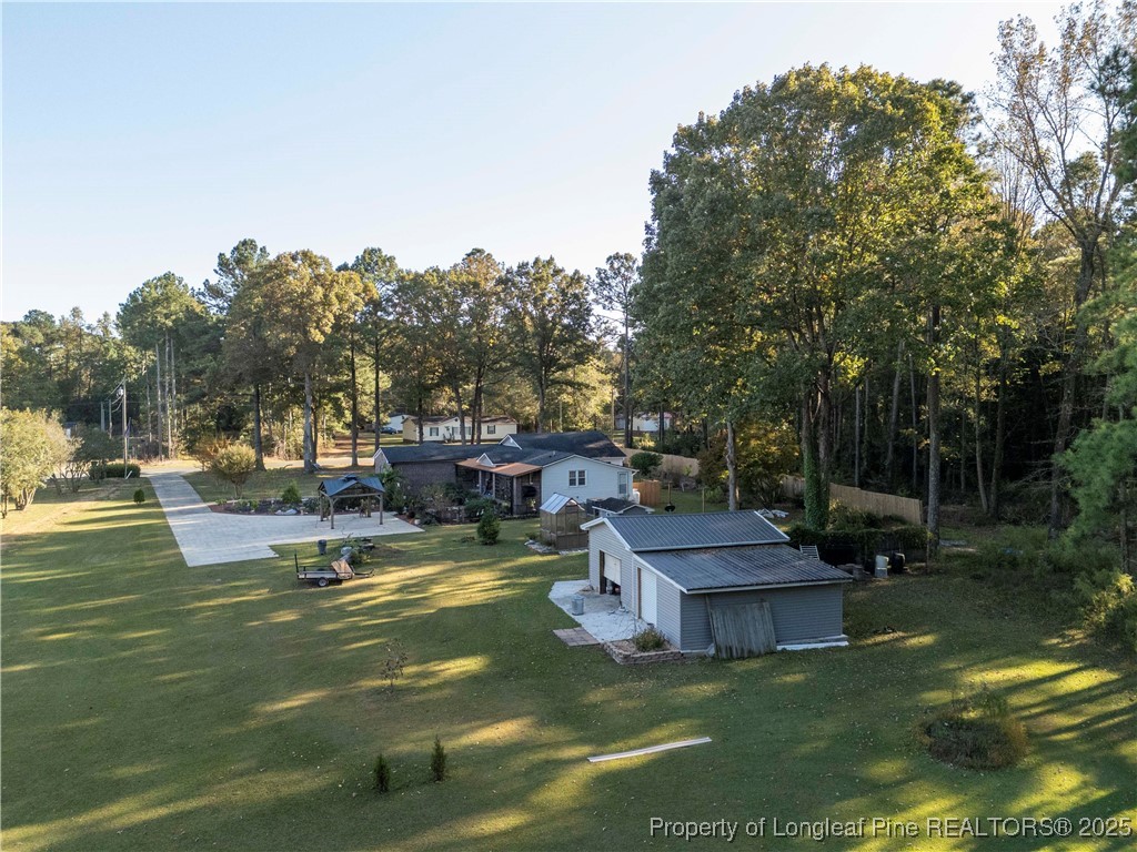 1855 Beaman Woods Road Clinton, NC 28328 - Photo 50 of 50 a view of a swimming pool with a patio