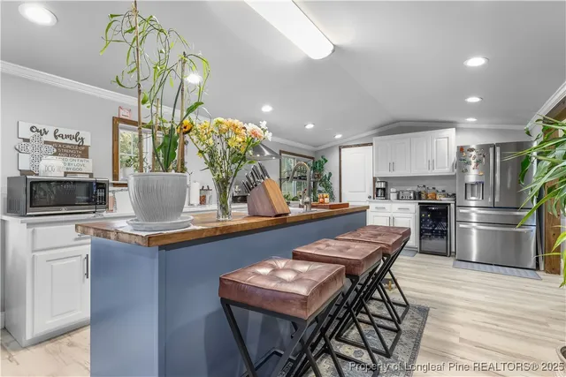 a kitchen with a table and chairs in it