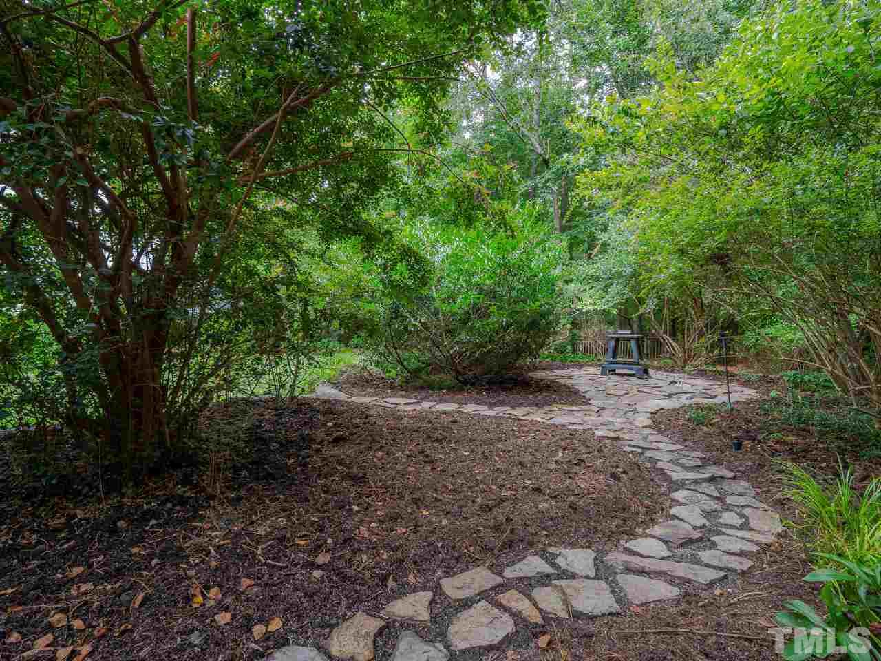 200 Claflin Court Raleigh, NC 27614 - Photo 12 of 13 a view of a forest with trees in the background