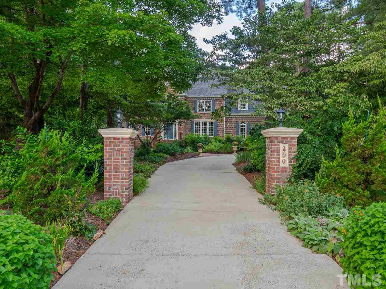200 Claflin Court Raleigh, NC 27614 - Photo 3 of 13 a front view of a house with a yard and trees