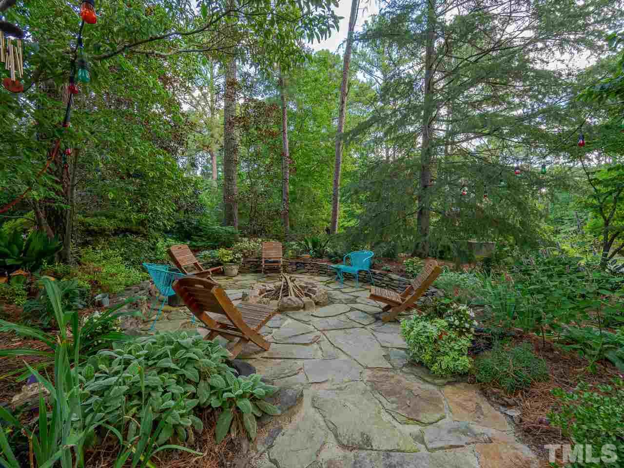 200 Claflin Court Raleigh, NC 27614 - Photo 4 of 13 a backyard of a house with table and chairs
