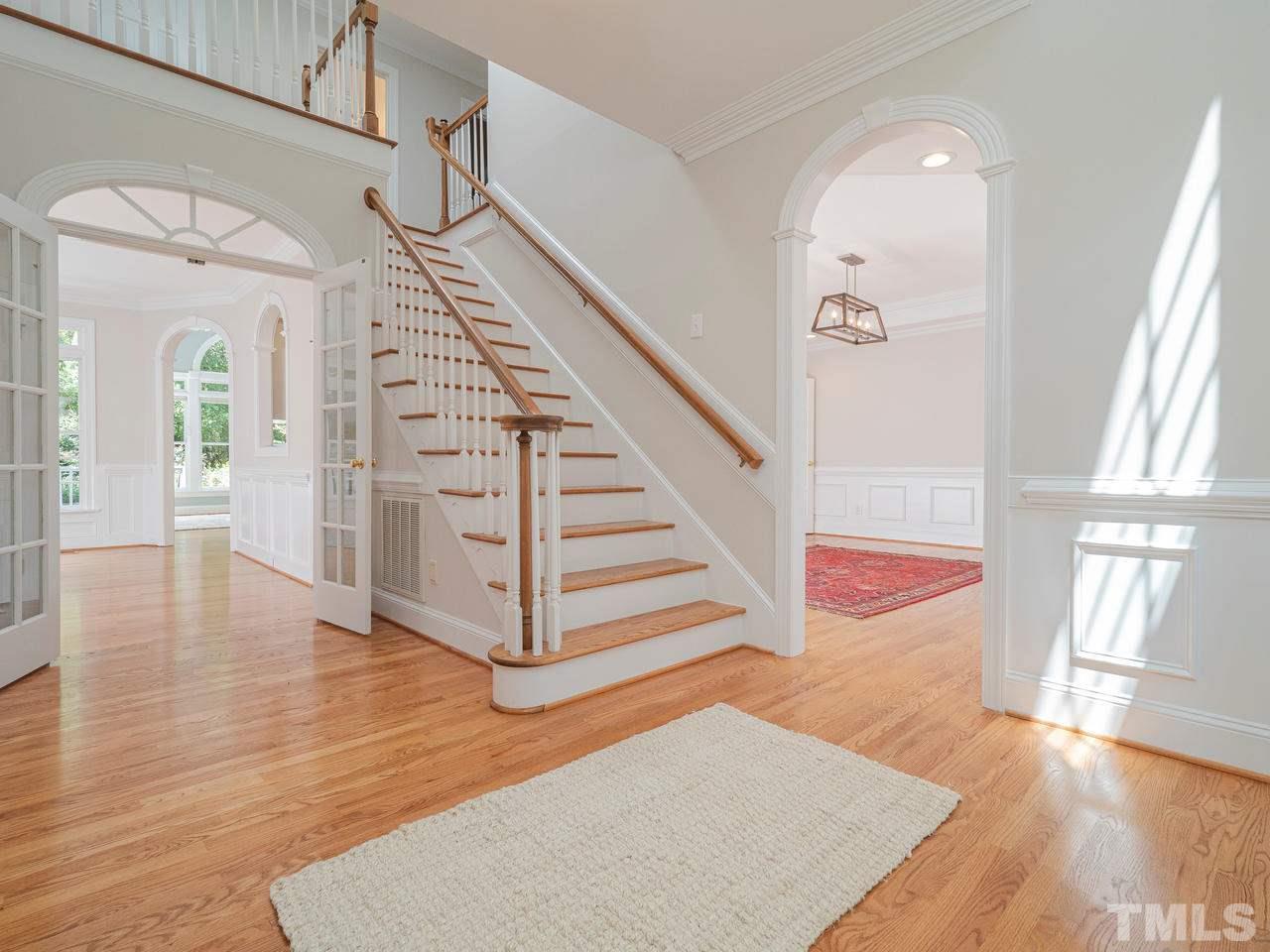 200 Claflin Court Raleigh, NC 27614 - Photo 5 of 13 a view of entryway and hall with wooden floor