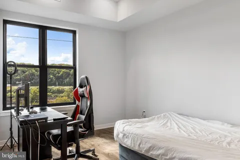 a bedroom with a bed and a table