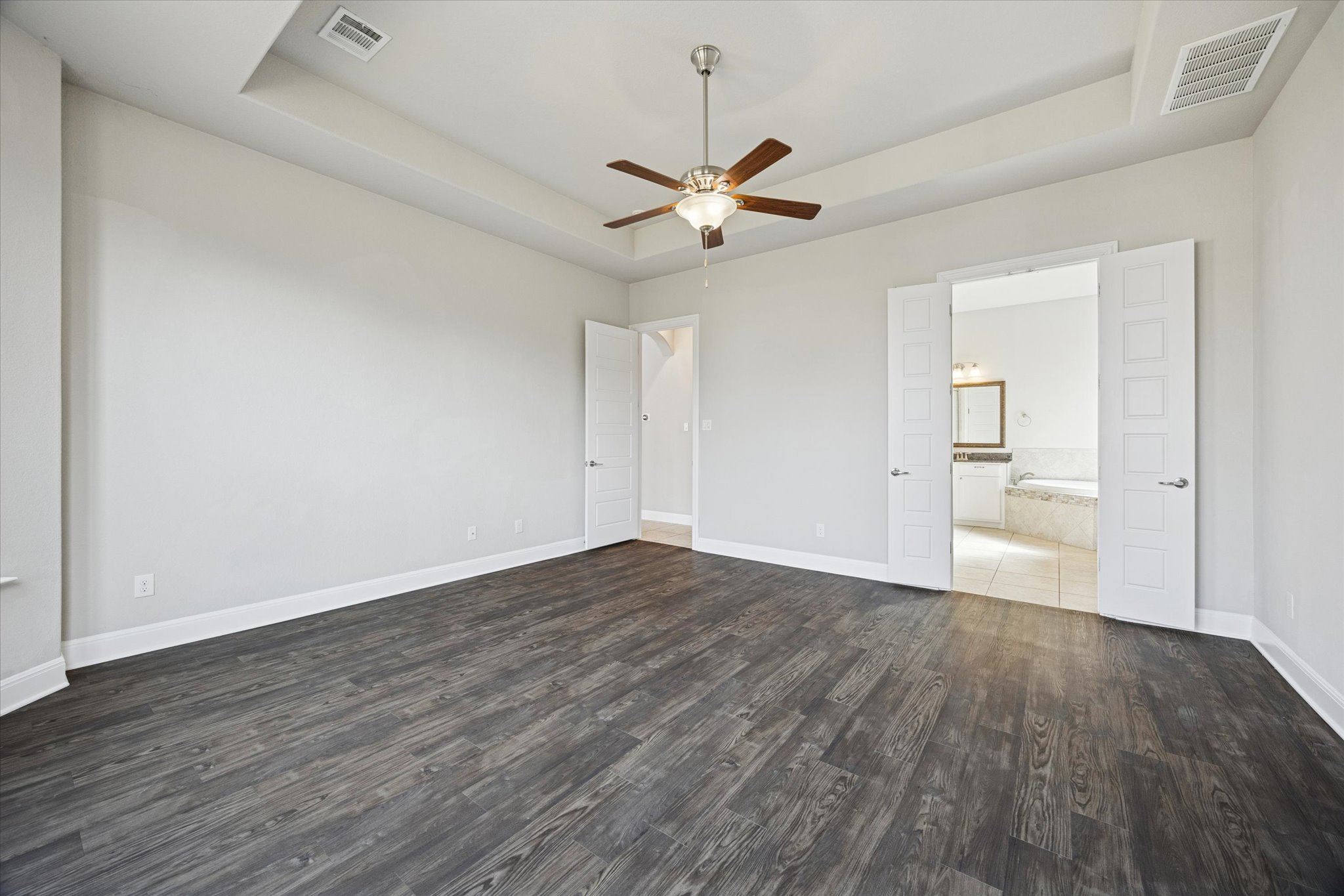 20516 Fairleaf Street Pflugerville, TX 78660 - Photo 18 of 38 wooden floor in an empty room with a window