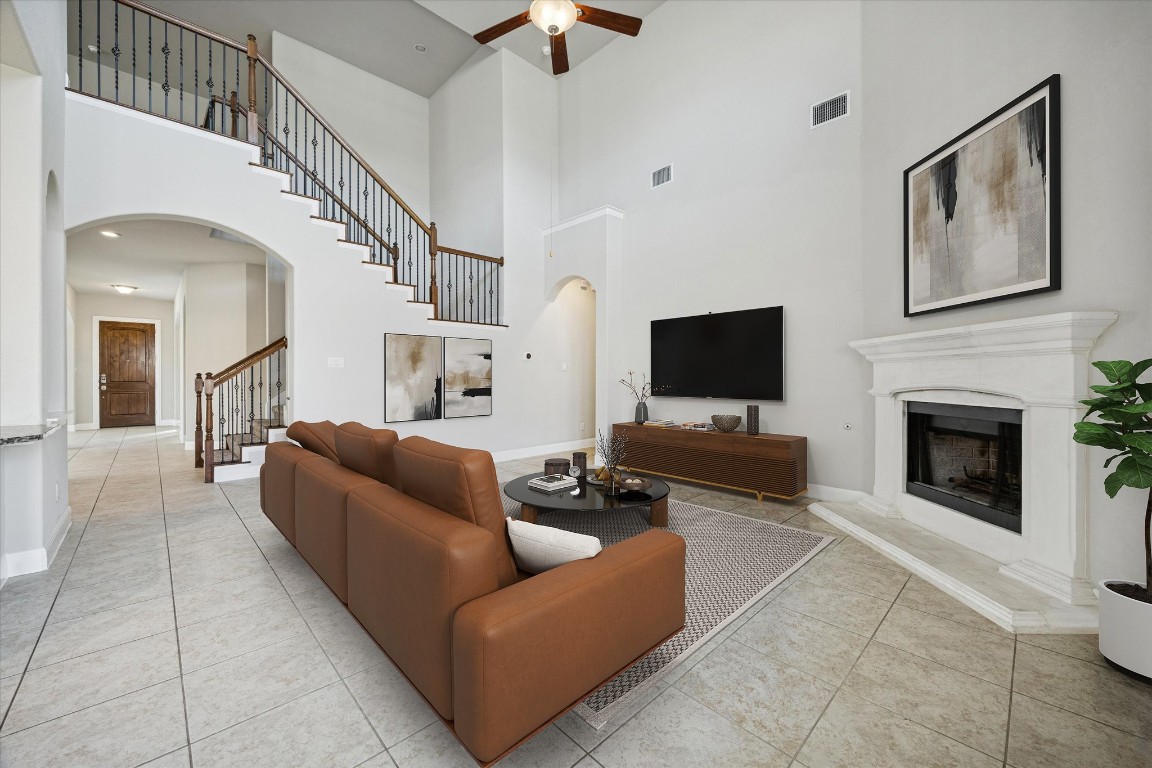 20516 Fairleaf Street Pflugerville, TX 78660 - Photo 2 of 38 Large living room with high ceilings and cozy fire place *virtually staged*