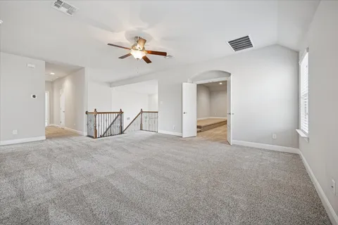 a view of a livingroom with a ceiling fan