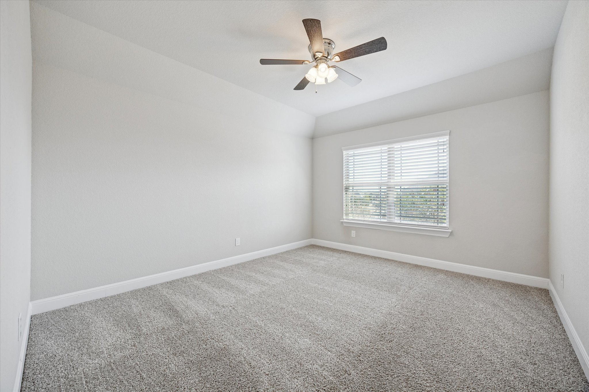 20516 Fairleaf Street Pflugerville, TX 78660 - Photo 26 of 38 an empty room with windows and fan
