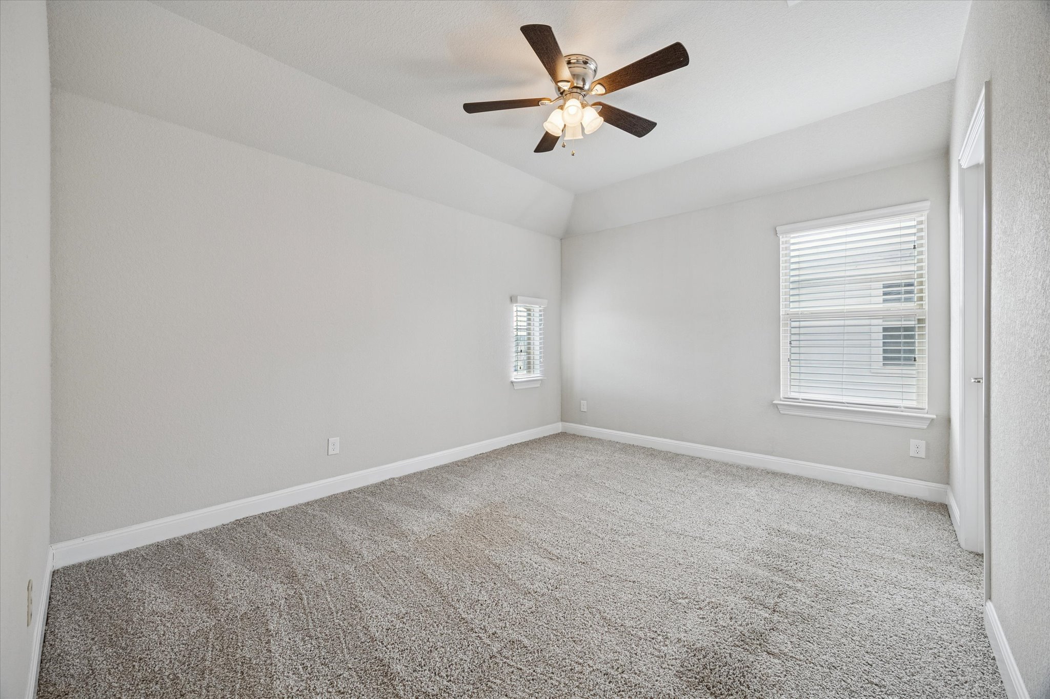 20516 Fairleaf Street Pflugerville, TX 78660 - Photo 28 of 38 an empty room with a window and a ceiling fan