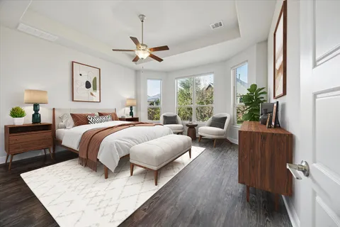 a bedroom with a large bed and a couch