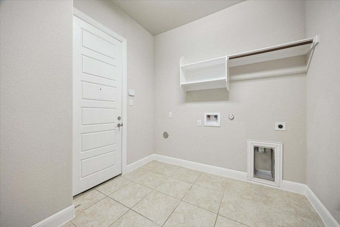 20516 Fairleaf Street Pflugerville, TX 78660 - Photo 35 of 38 Laundry room downstairs connected to garage
