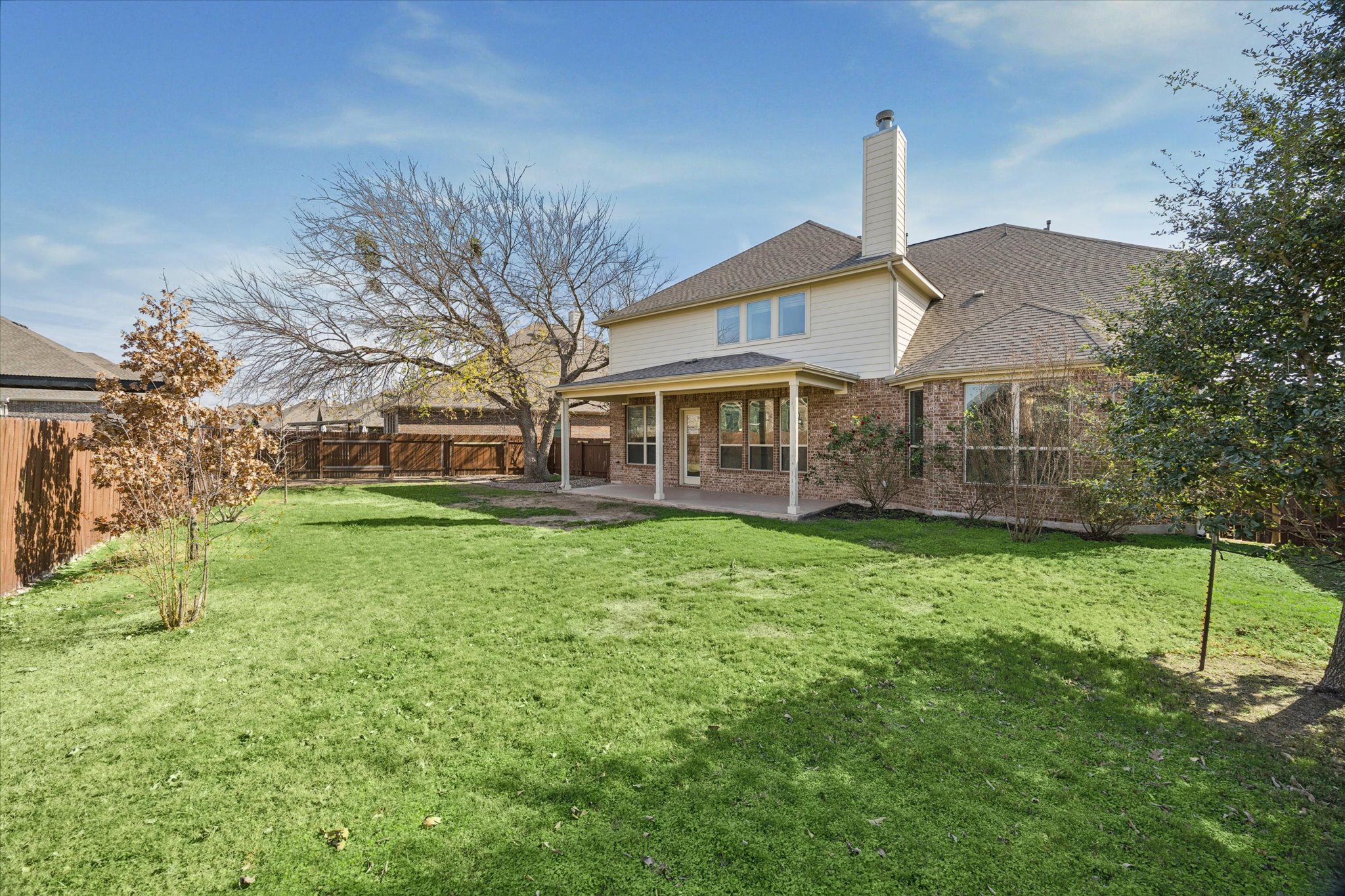 20516 Fairleaf Street Pflugerville, TX 78660 - Photo 4 of 38 a front view of a house with a garden