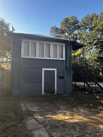 a house view with a backyard space