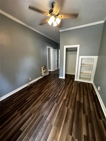 a view of an empty room and wooden floor