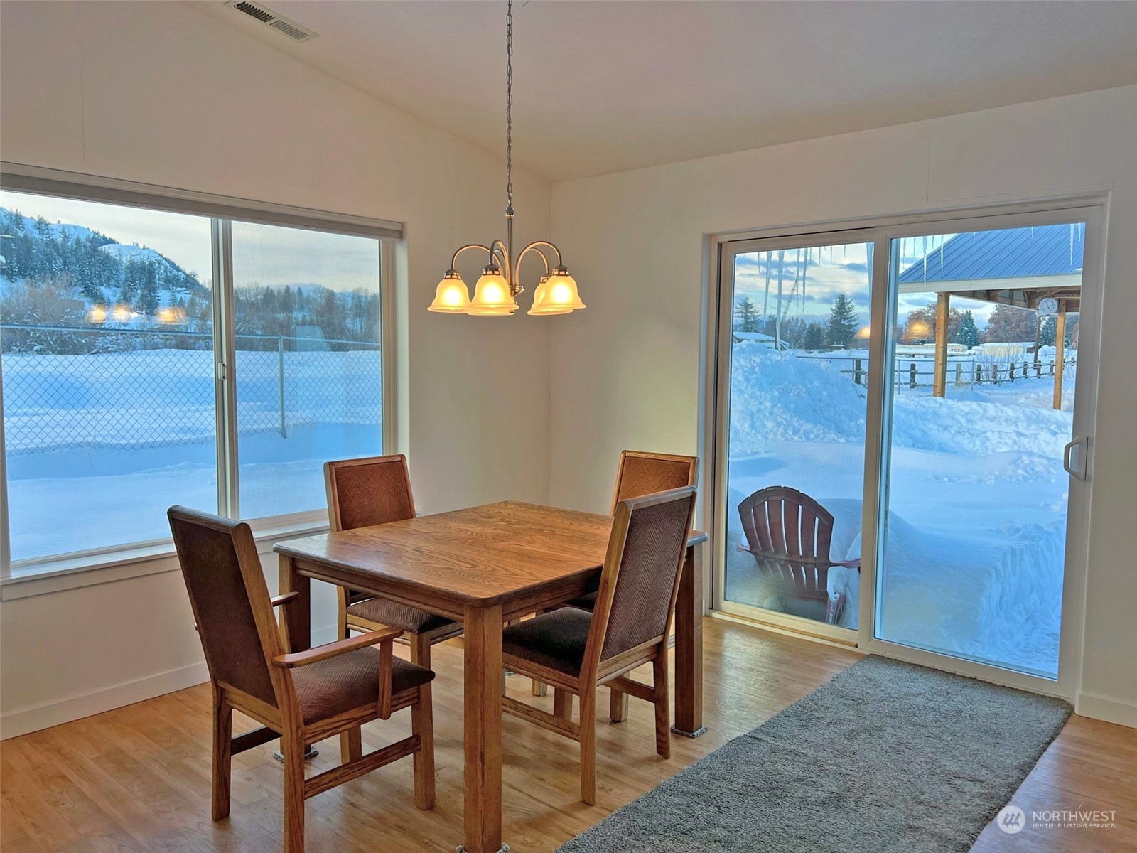 1004 Riverside Avenue Twisp, WA 98856 - Photo 11 of 40 a view of a dining room with furniture window and wooden floor