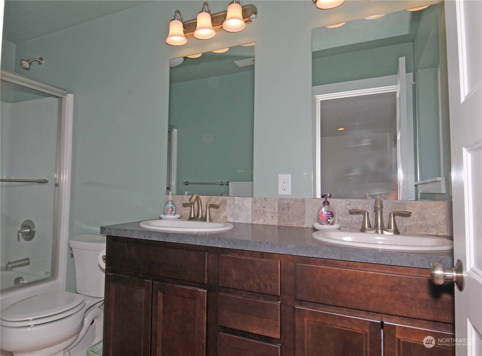 1004 Riverside Avenue Twisp, WA 98856 - Photo 14 of 40 a bathroom with a sink a toilet and shower