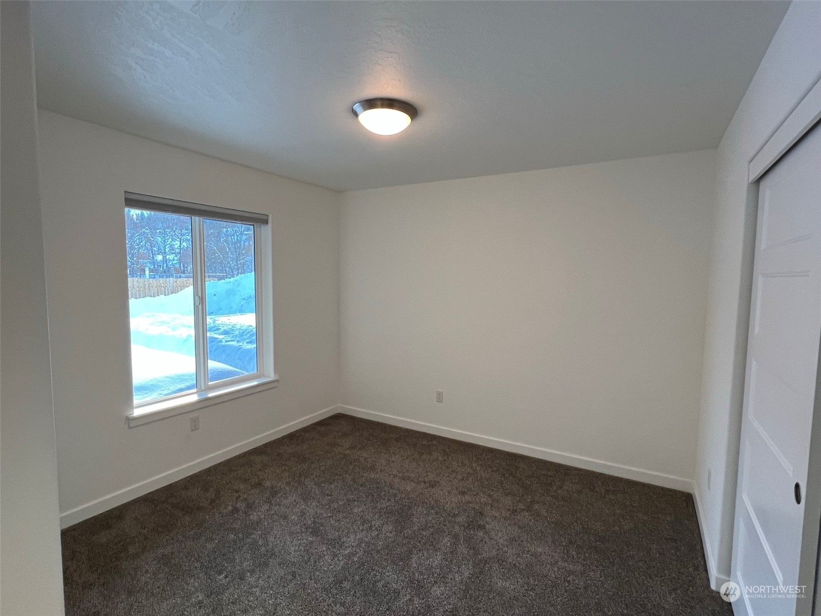 1004 Riverside Avenue Twisp, WA 98856 - Photo 16 of 40 an empty room with a window