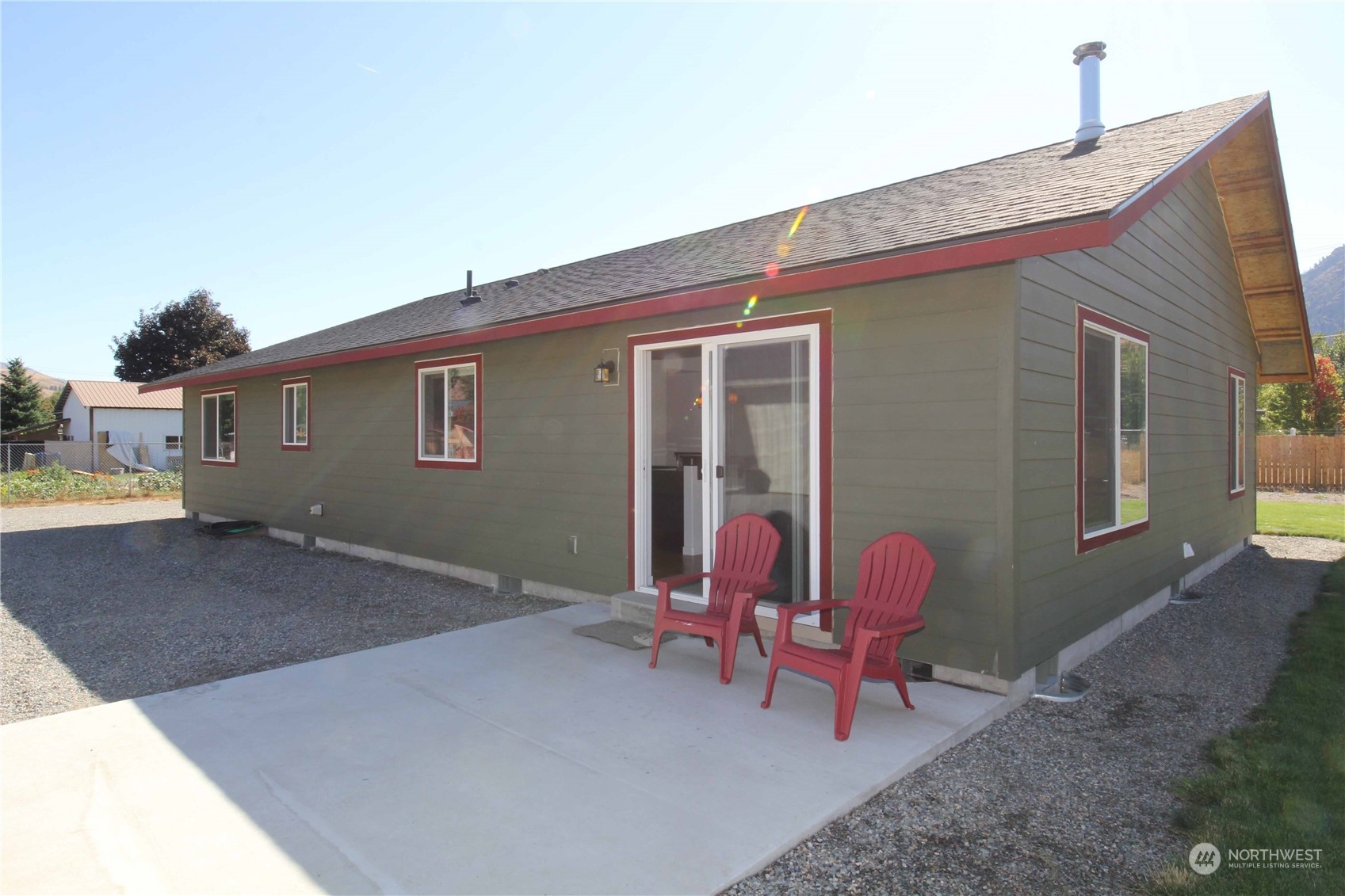 1004 Riverside Avenue Twisp, WA 98856 - Photo 27 of 40 a backyard of a house with outdoor seating