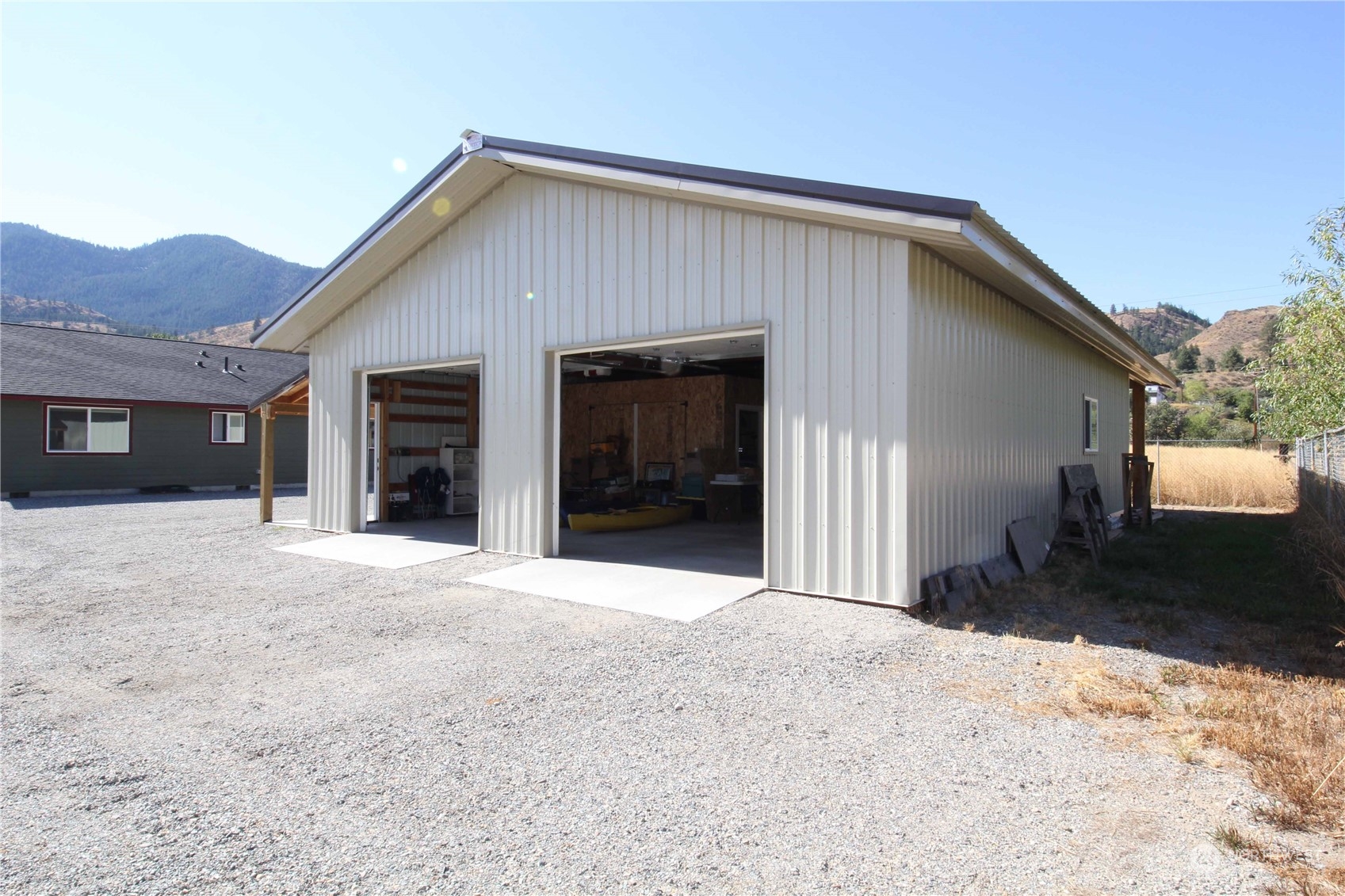 1004 Riverside Avenue Twisp, WA 98856 - Photo 40 of 40 a front view of a house with a yard and garage