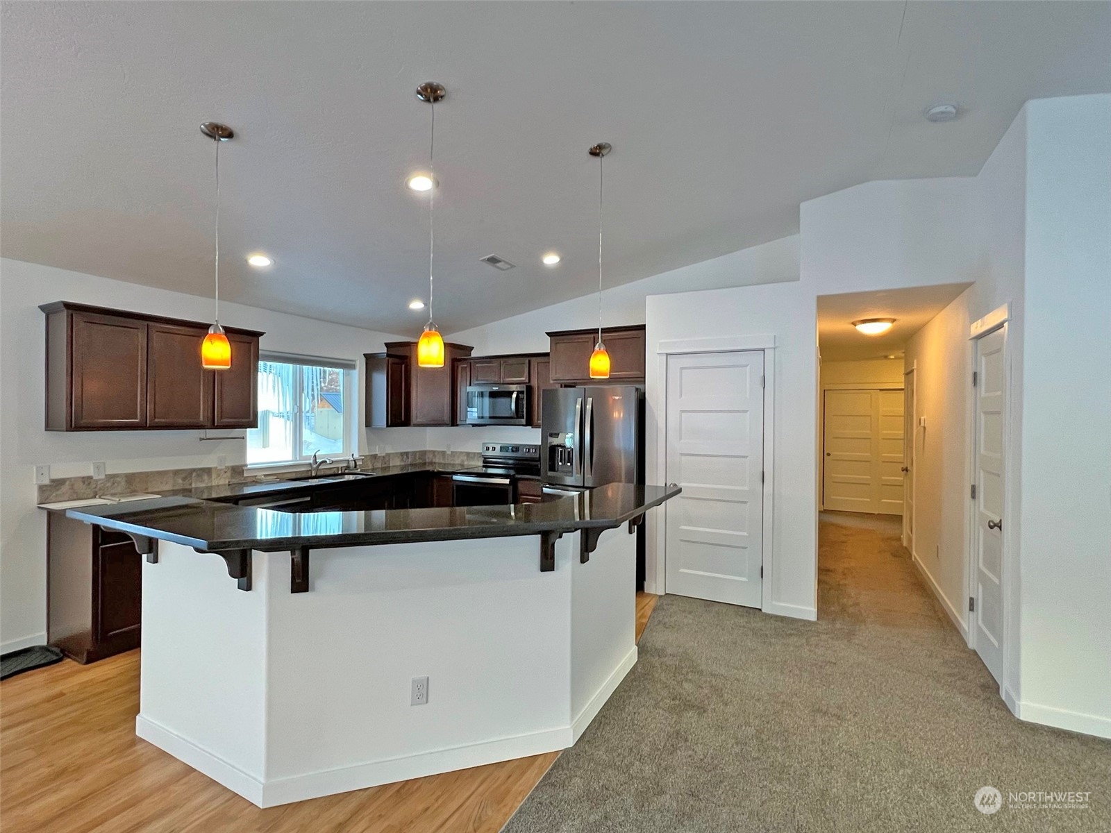 1004 Riverside Avenue Twisp, WA 98856 - Photo 8 of 40 a kitchen with stainless steel appliances granite countertop a stove and a sink