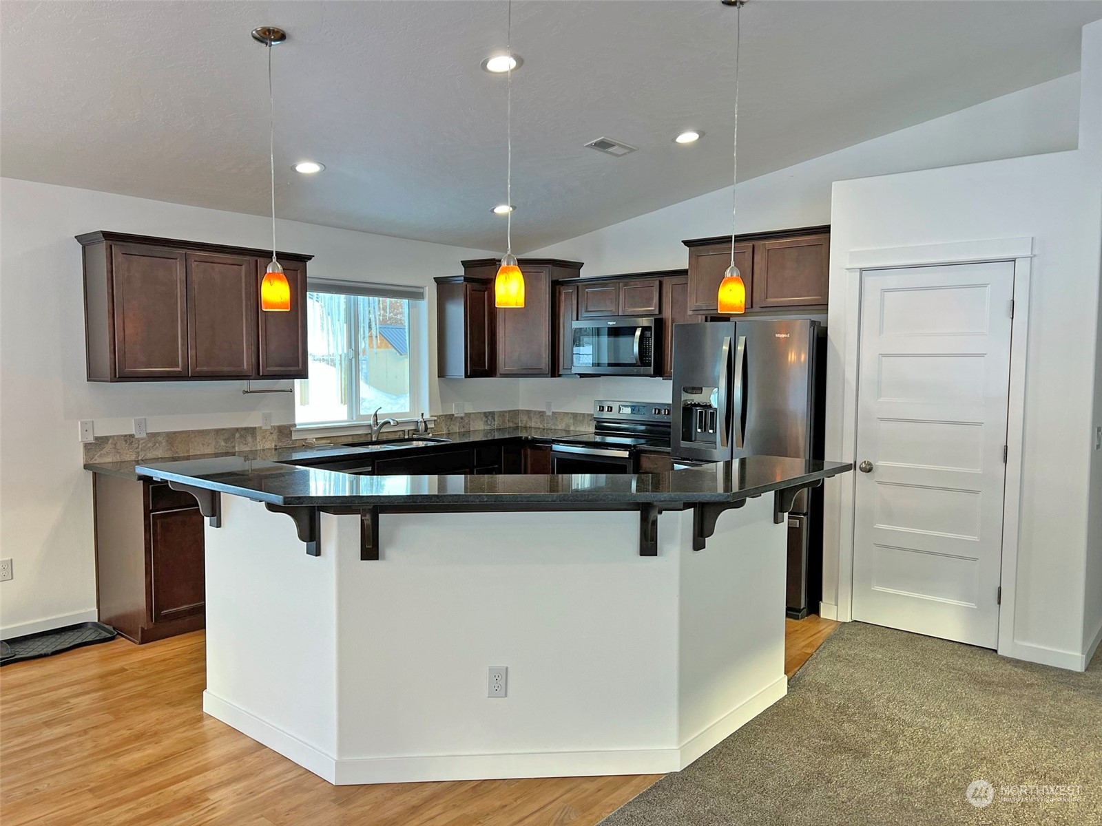 1004 Riverside Avenue Twisp, WA 98856 - Photo 9 of 40 a kitchen with stainless steel appliances granite countertop a sink and a refrigerator