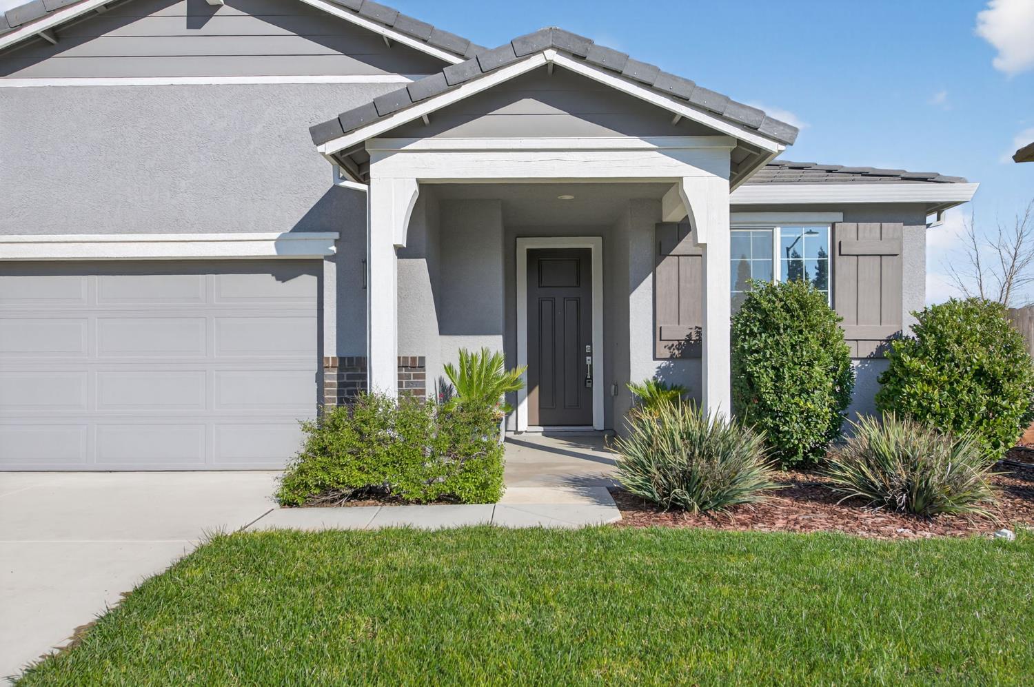 2431 Creekview Drive Merced, CA 95340 - Photo 11 of 38 a front view of a house with a yard
