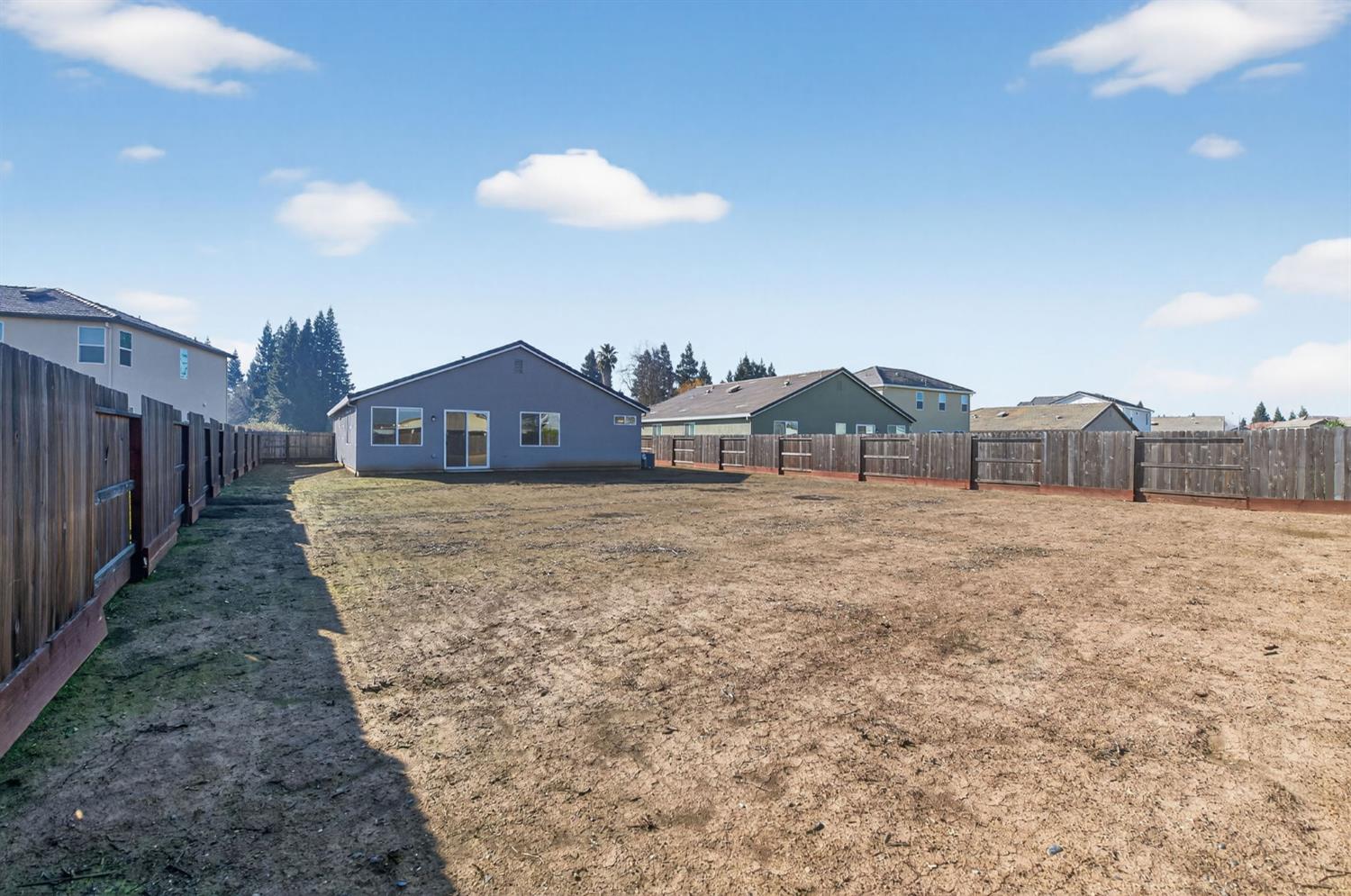 2431 Creekview Drive Merced, CA 95340 - Photo 23 of 38 a view of a house with a yard