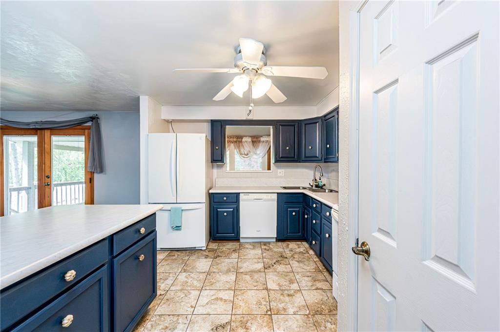621 Sandy Hill Road Irwin, PA 15642 - Photo 15 of 50 a kitchen with a stove a sink and a refrigerator