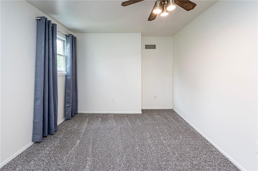 621 Sandy Hill Road Irwin, PA 15642 - Photo 21 of 50 an empty room with a chandelier fan