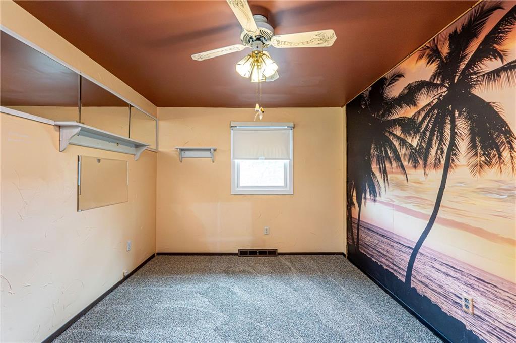 621 Sandy Hill Road Irwin, PA 15642 - Photo 24 of 50 a view of a room with a ceiling fan and a rug