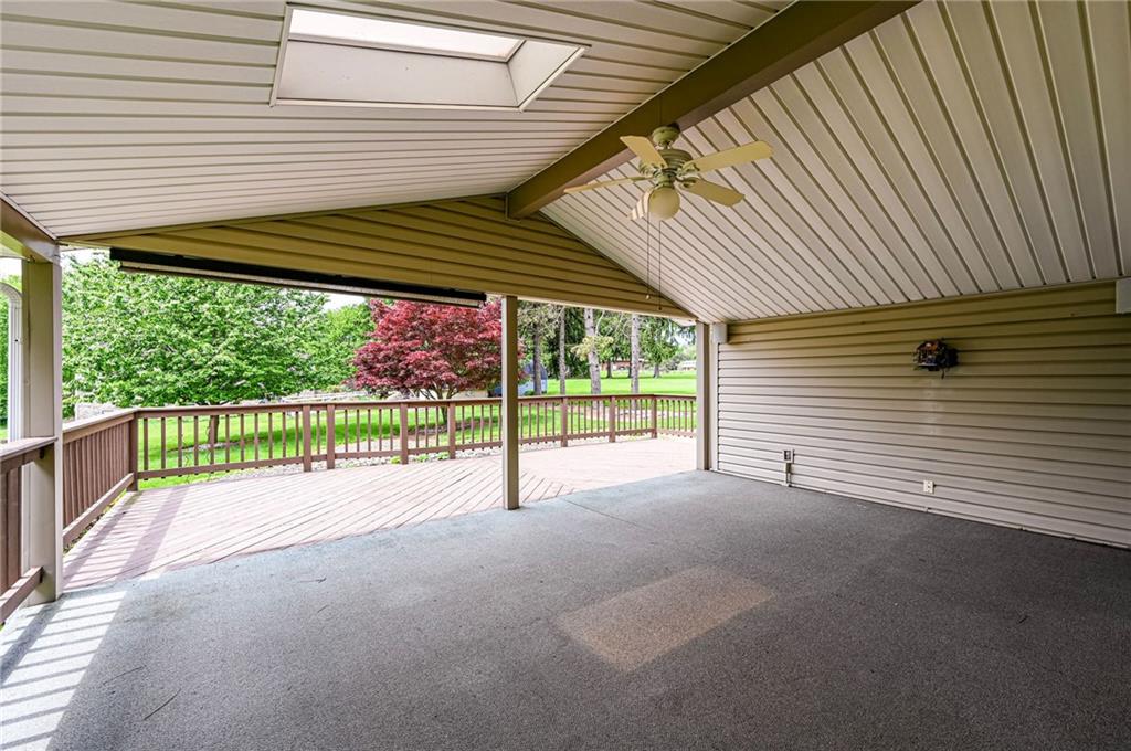621 Sandy Hill Road Irwin, PA 15642 - Photo 39 of 50 a view of a porch with wooden floor next to a yard