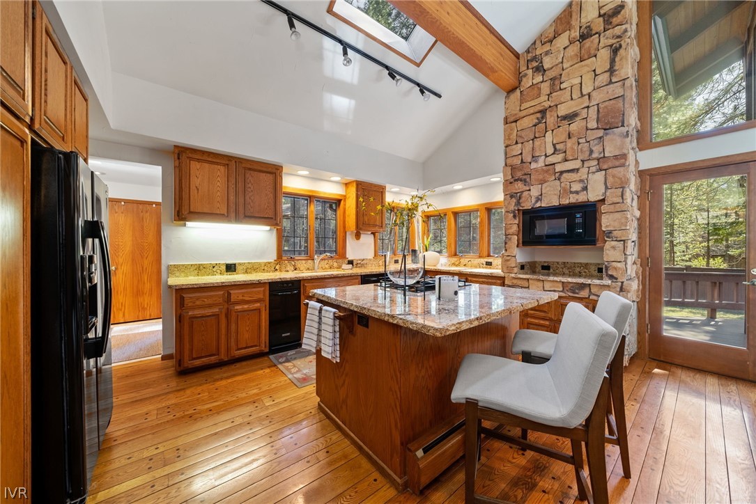 106 Jobs Peak Road Incline Village, NV 89451 - Photo 6 of 49 a kitchen with stainless steel appliances granite countertop sink stove top oven and cabinets