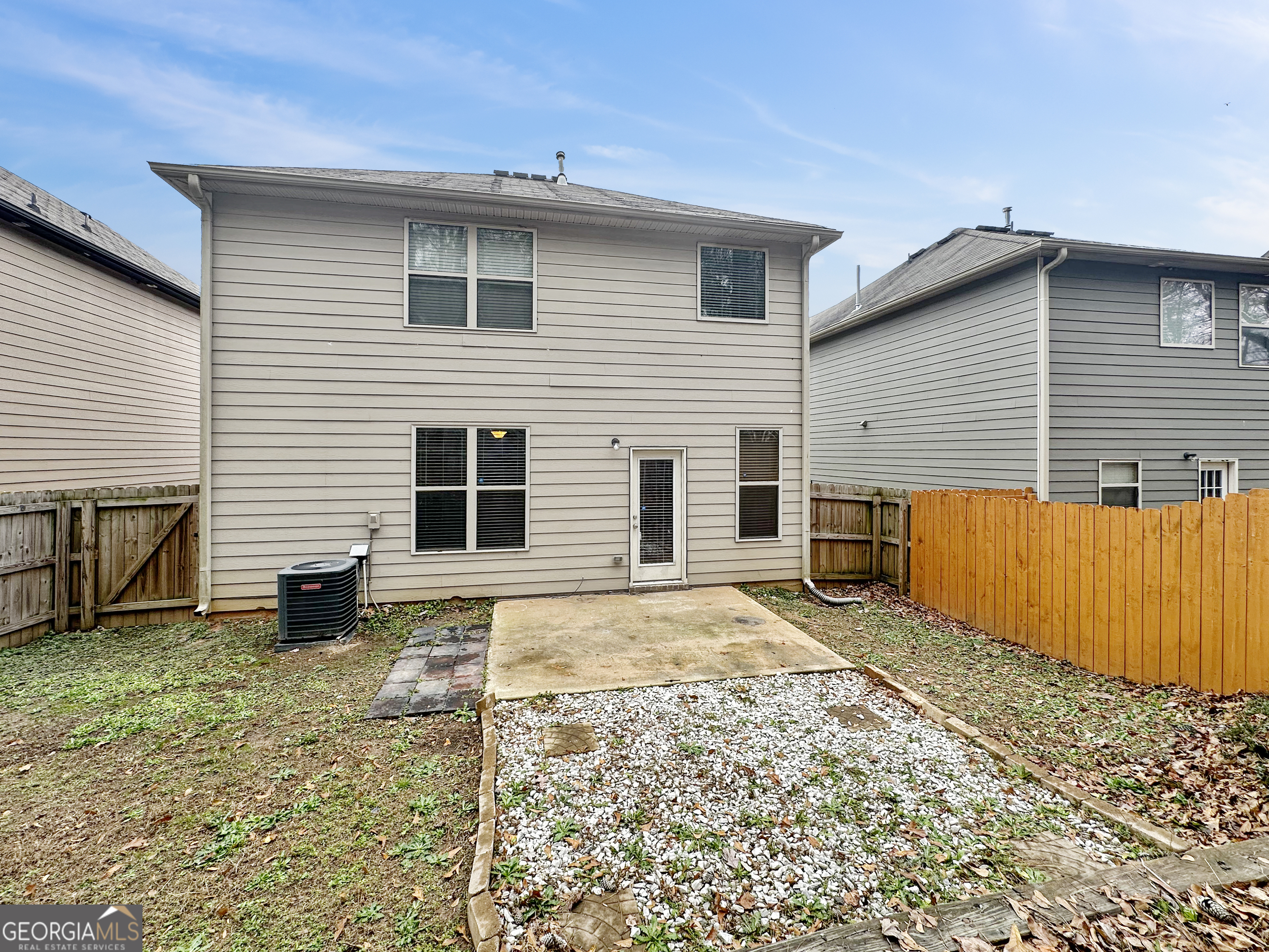 5689 Grande River Road Atlanta, GA 30349 - Photo 16 of 18 a view of a house with a yard
