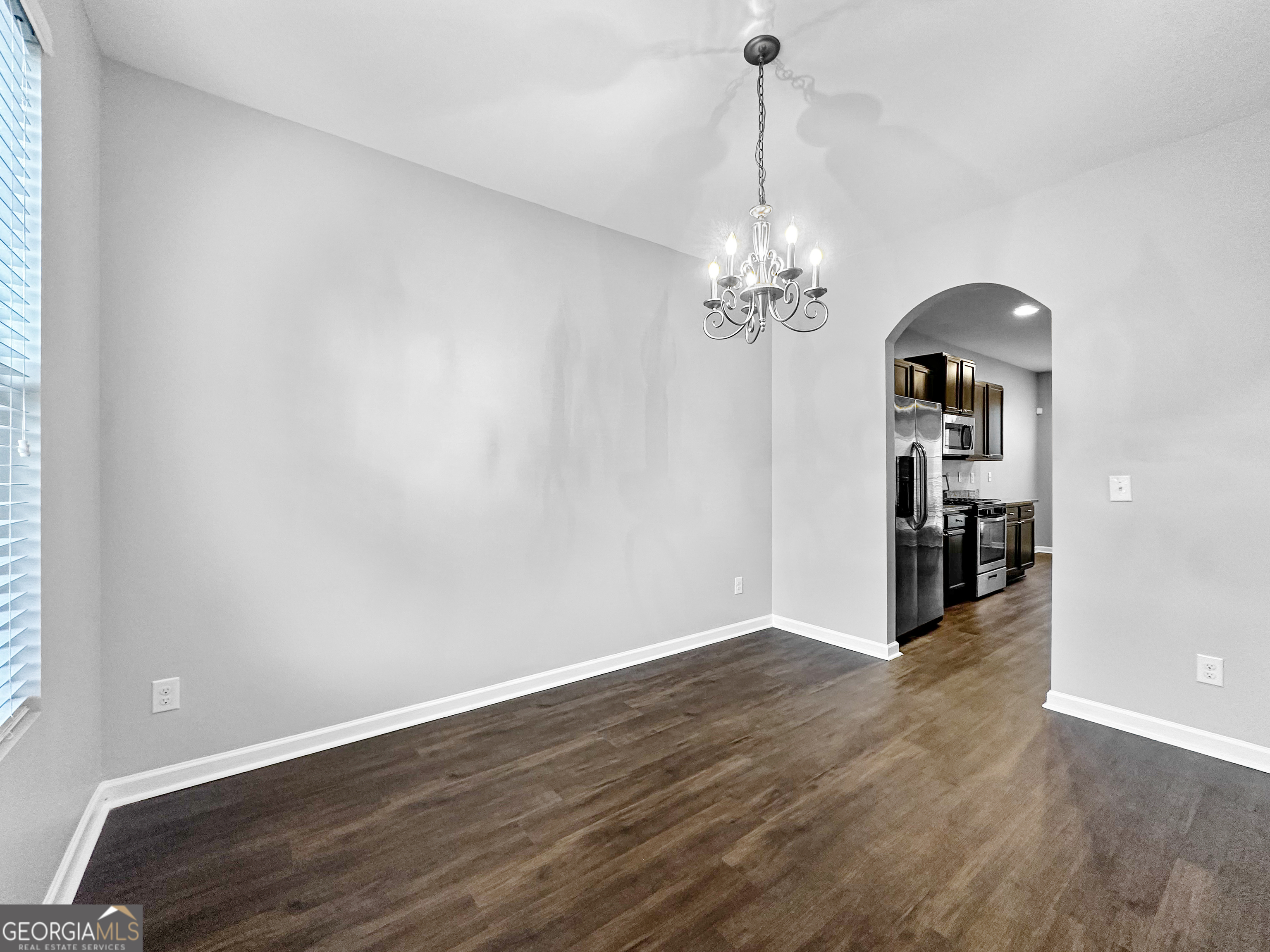 5689 Grande River Road Atlanta, GA 30349 - Photo 6 of 18 a view of a chandelier in a room
