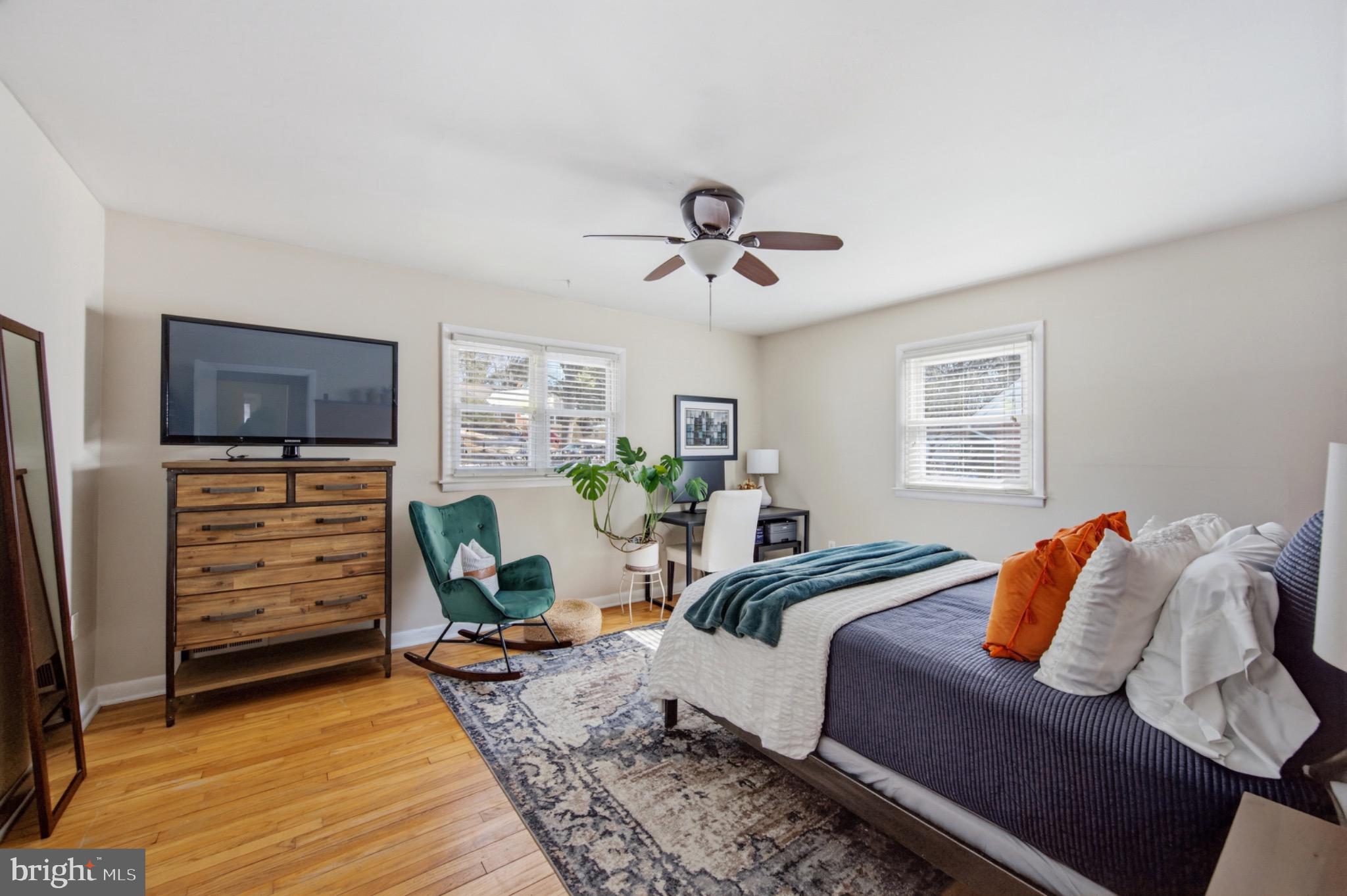 6750 Glenkirk Road Baltimore, MD 21239 - Photo 11 of 60 a bedroom with furniture and a window