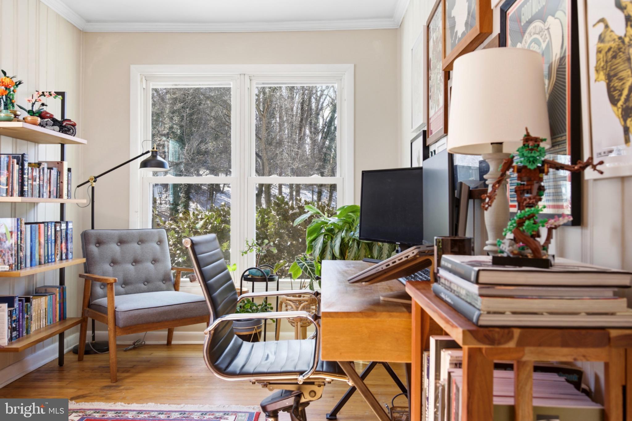 6750 Glenkirk Road Baltimore, MD 21239 - Photo 14 of 60 a living room with furniture and a potted plant